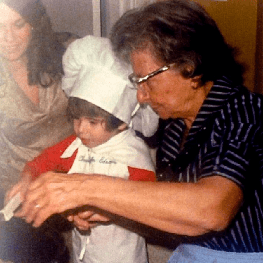 woman and boy cutting cookie