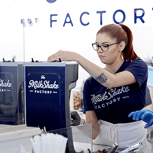 employee mixing milkshake