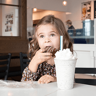 little girl eating chocolate