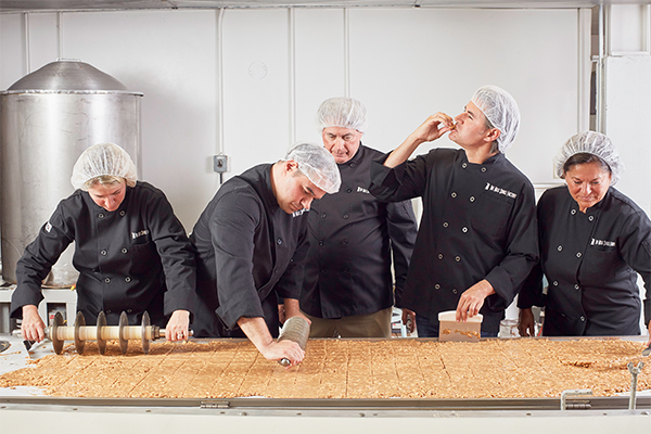 group of people in chocolate factory